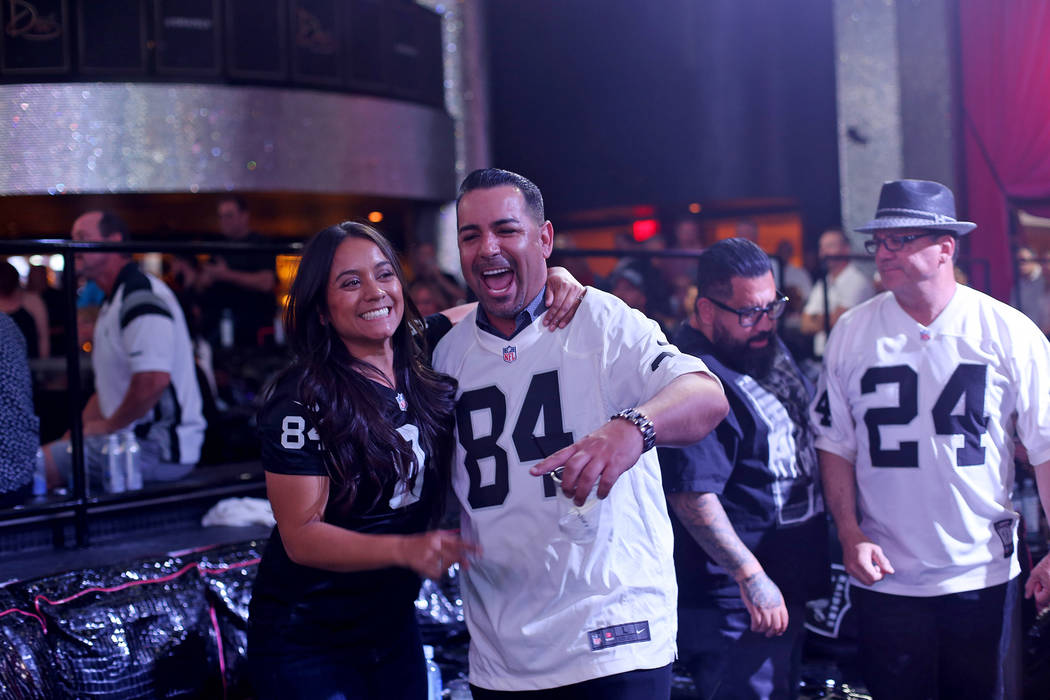 Veronica Diaz, left, laughs with husband Kevin Shaughnessy at a Raiders draft party at Drai's n ...