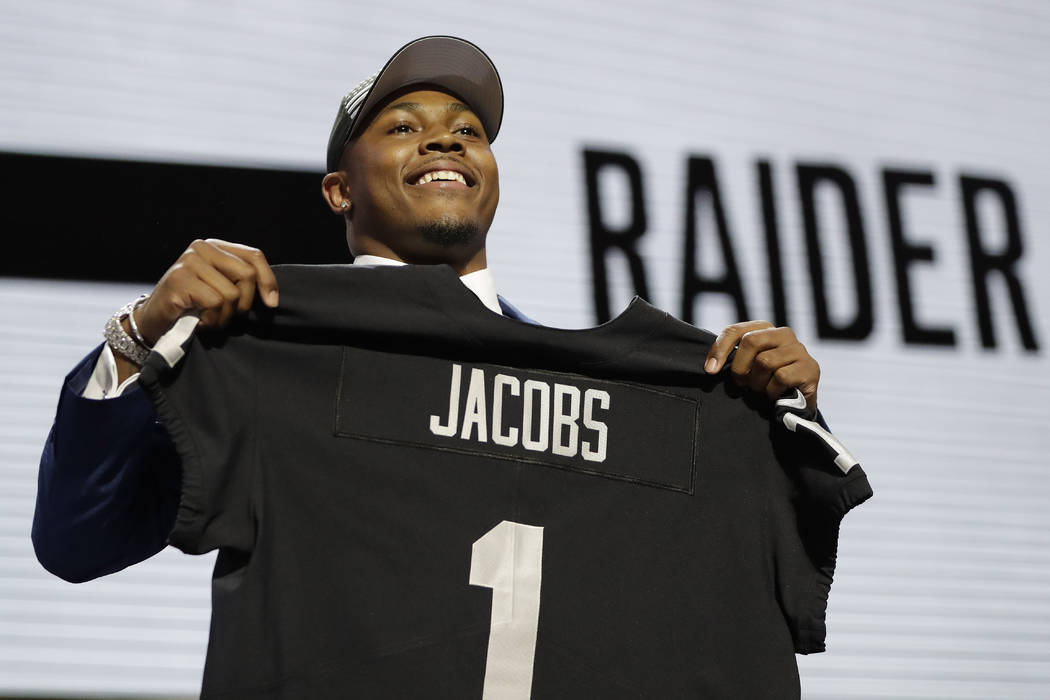 Alabama running back Josh Jacobs poses withhis new jersey after the Oakland Raiders selected Ja ...