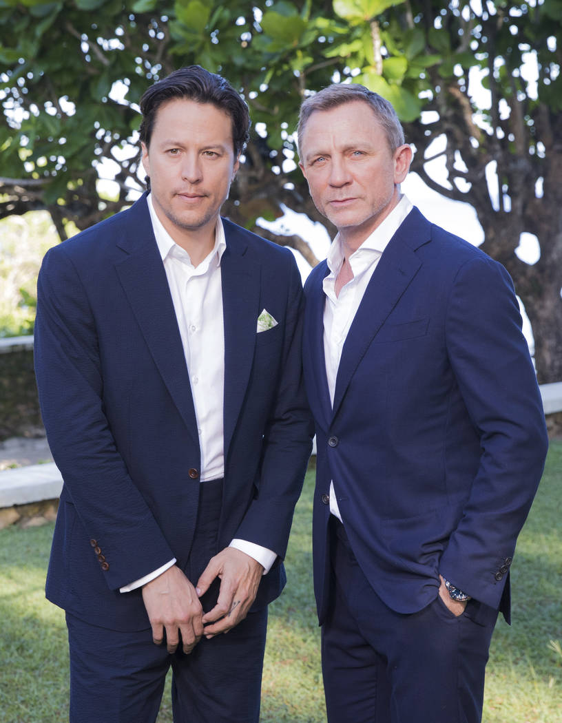 Director Cary Joji Fukunaga, left, and actor Daniel Craig pose for photographers during the pho ...
