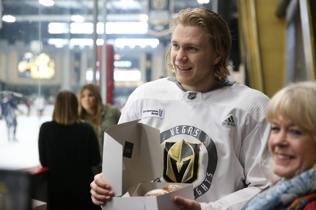 Vegas Golden Knights center William Karlsson (71) receives Swedish pastries made on Fat Tuesday ...