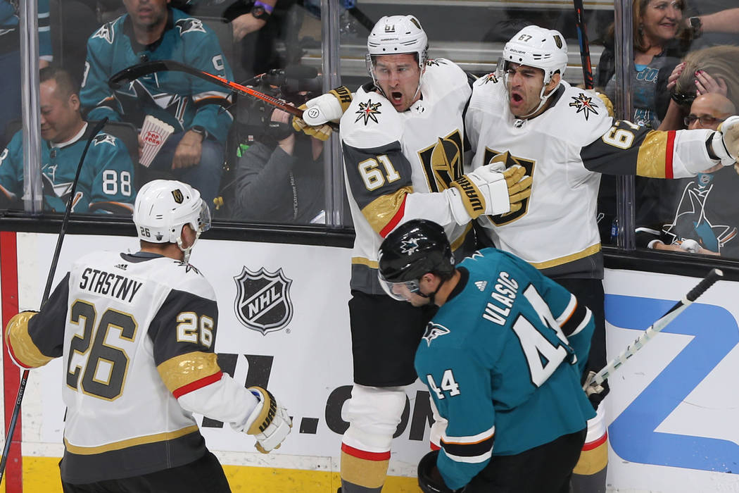 Golden Knights left wing Max Pacioretty (67) celebrates with teammates Mark Stone (61) and Paul ...