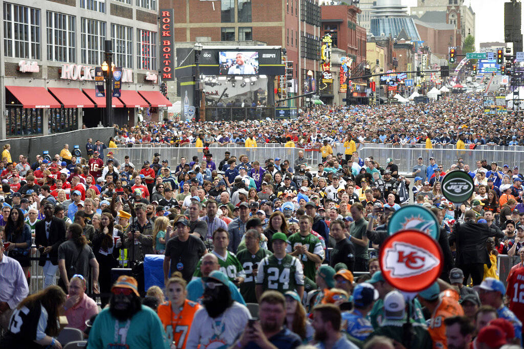 Fans crowd Broadway during the 2019 NFL Draft Thursday, Apr. 25, 2019, in Nashville, Tenn. (AP ...