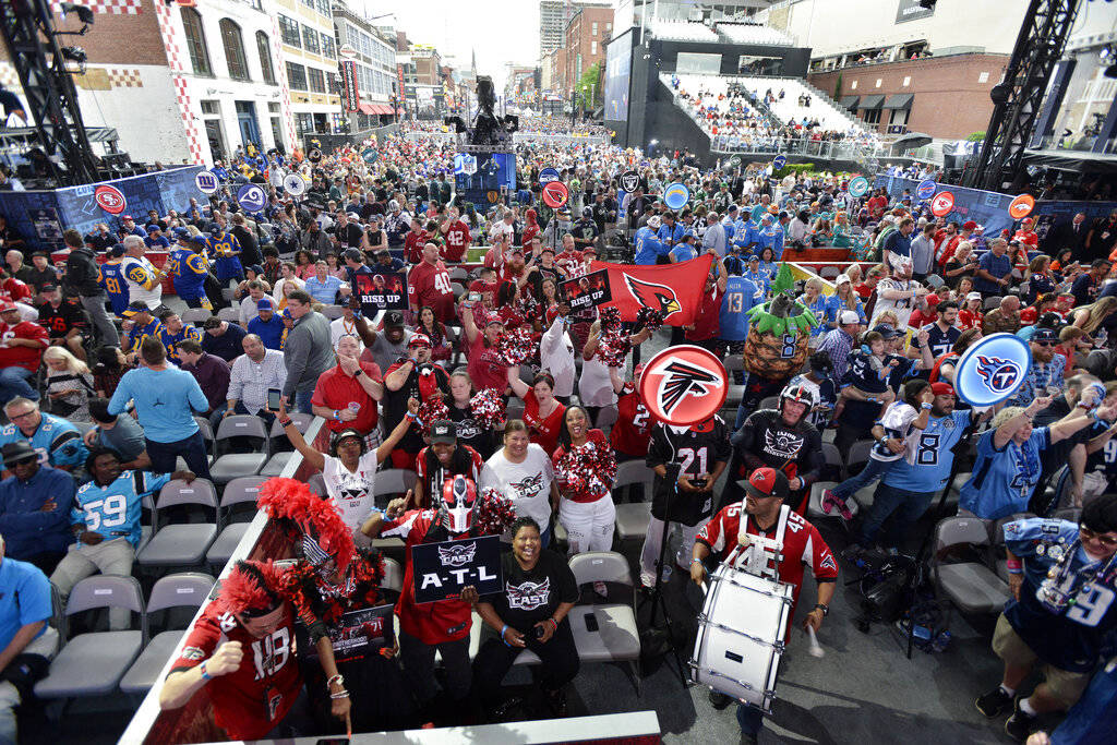 Fans gather in front of the stage during the 2019 NFL Draft Thursday, Apr. 25, 2019, in Nashvil ...