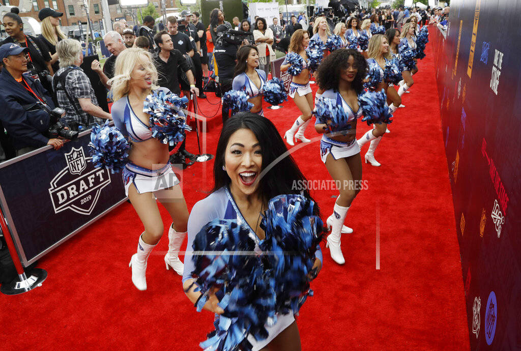 Tennessee Titans cheerleaders perform on the red carpet ahead of the first round at the NFL foo ...