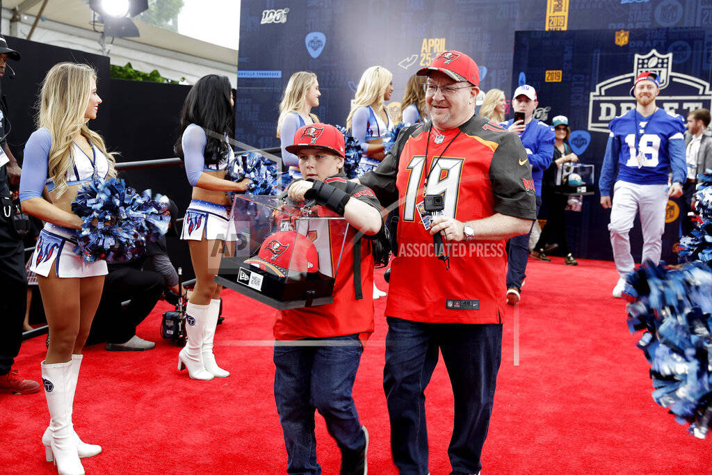 Fans walks the red carpet ahead of the first round at the NFL football draft, Thursday, April 2 ...