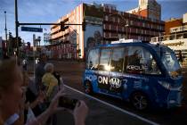 A self-driving vehicle tours people in downtown Las Vegas near the Container Park, Thursday, No ...