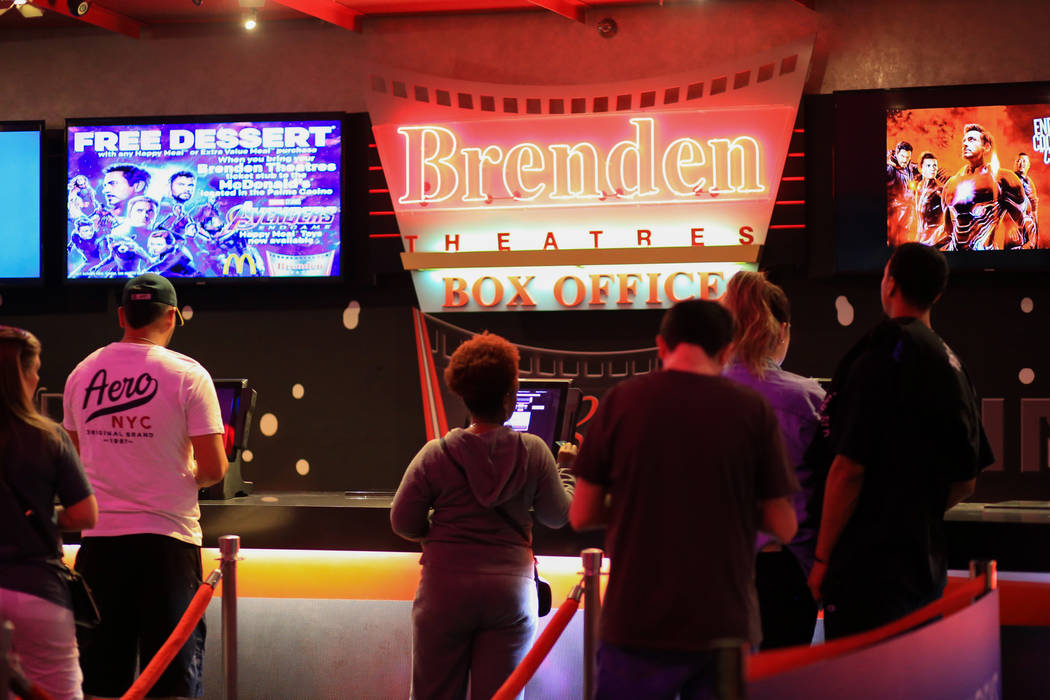 Moviegoers buy tickets before the first showing of "Avengers: Endgame" at Brenden Theaters at t ...
