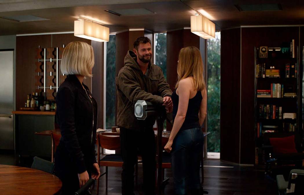 This image released by Disney shows, from left, Scarlett Johansson, Chris Hemsworth and Brie La ...