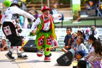 Children watch as Chirolito and Bobofito perform during the 10th annual Dia del Nino event at t ...