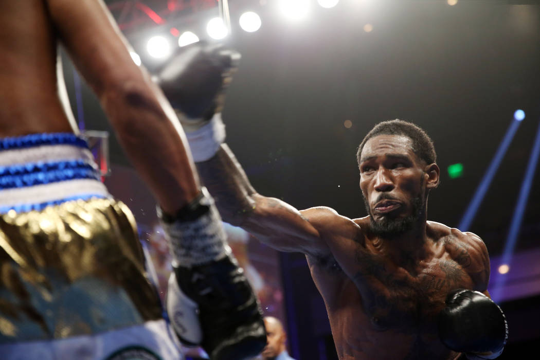 Robert Easter Jr., right, throws a punch against Rances Barthelemy in the WBA lightweight champ ...