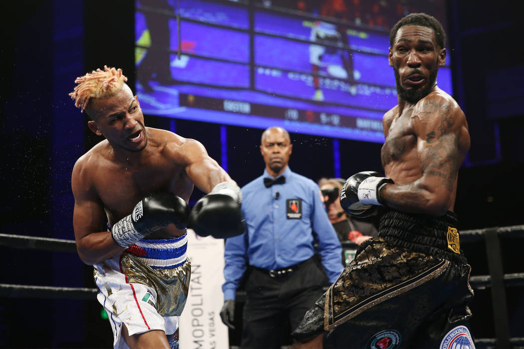 Rances Barthelemy, left, throws a punch against Robert Easter Jr. in the WBA lightweight champi ...
