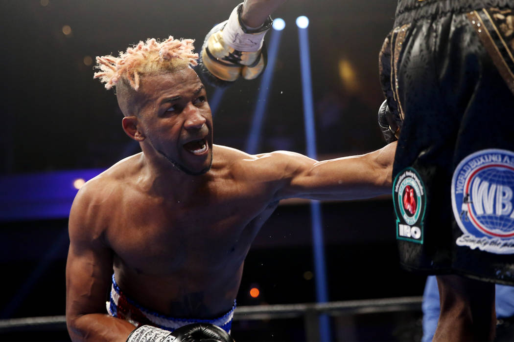 Rances Barthelemy, left, throws a punch against Robert Easter Jr. in the WBA lightweight champi ...