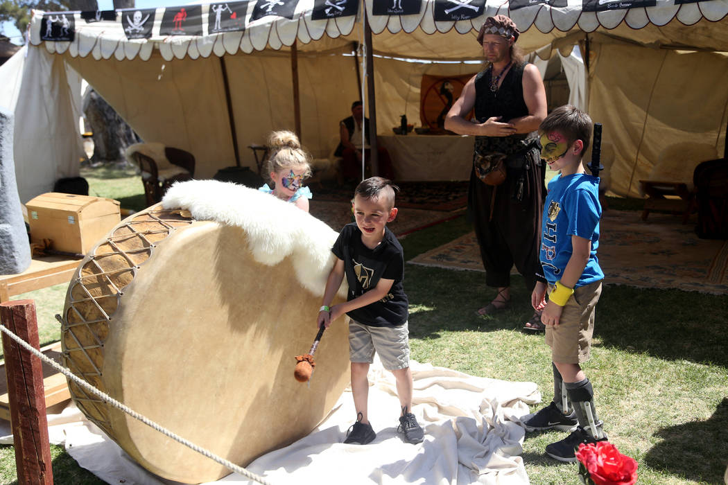 Alex Montes, 6, hits a drum at the Rolling Thunder Drum Classes at the Pirate Fest at Craig Ran ...