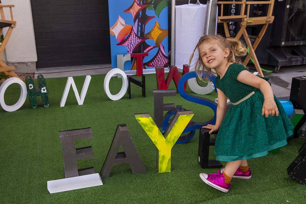 Faye Kerlin Stoelting, 3, spells out her name during the Believer Festival, a three-day literar ...