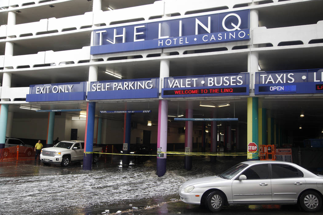Rain causes flooding at The Linq Hotel and casino parking garage in Las Vegas, Monday, April 29 ...