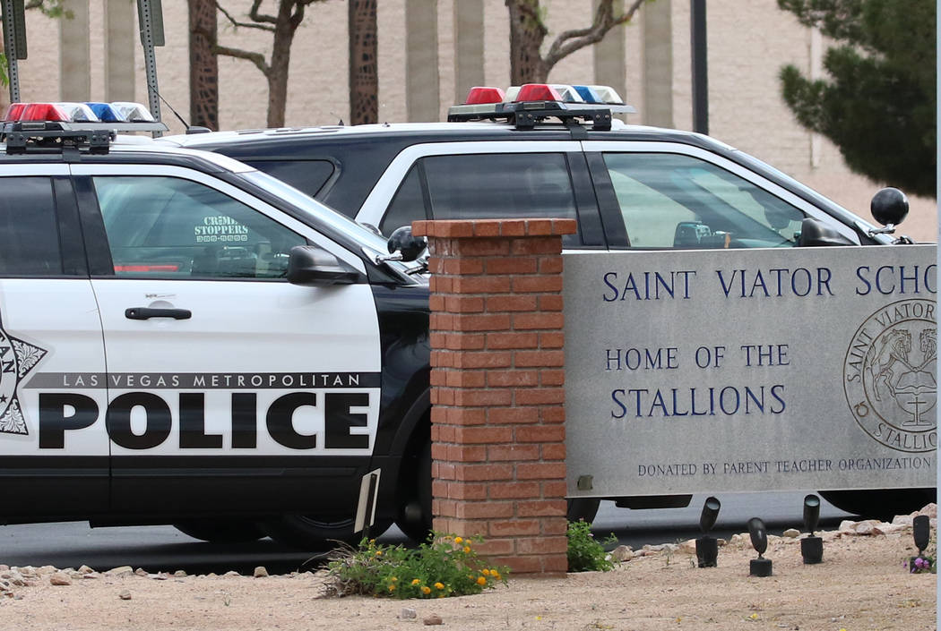 Las Vegas police are seen at St. Viator Parish School in Las Vegas at Eastern Avenue and Flamin ...