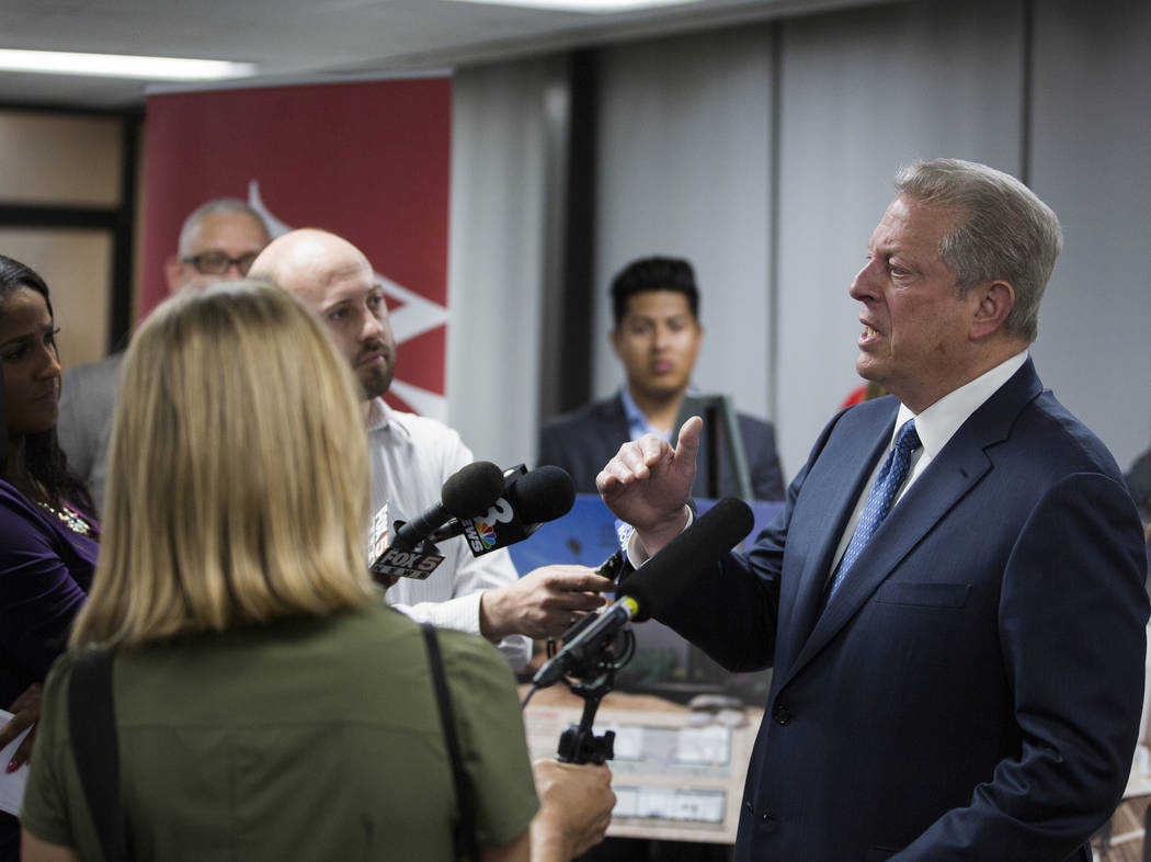 Former U.S. Vice President Al Gore, right, addresses the media after meeting with UNLV's solar ...