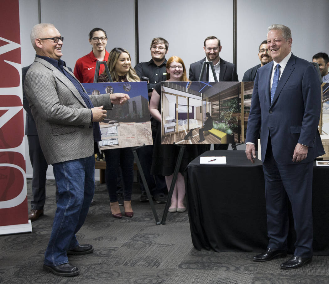 Former U.S. Vice President Al Gore, right, shares a laugh with UNLV professor Erik Weber during ...