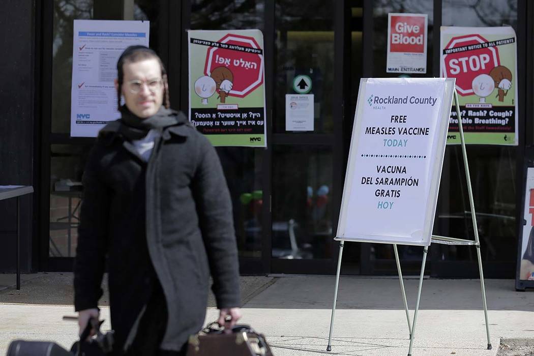 Signs about measles and the measles vaccine are displayed March 27, 2019, at the Rockland Count ...
