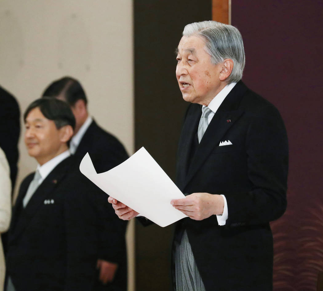 Japan's Emperor Akihito speaks during the ceremony of his abdication in front of other members ...