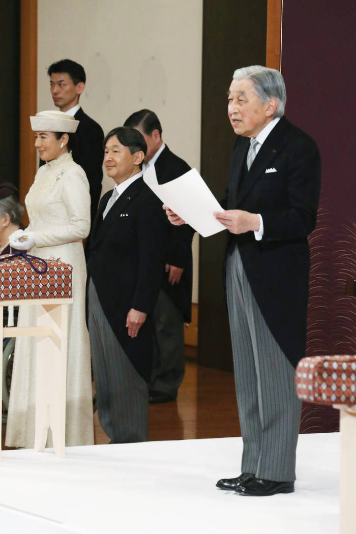 Japan's Crown Prince Naruhito, second from left, and Crown Princess Masako, left, listen to Emp ...