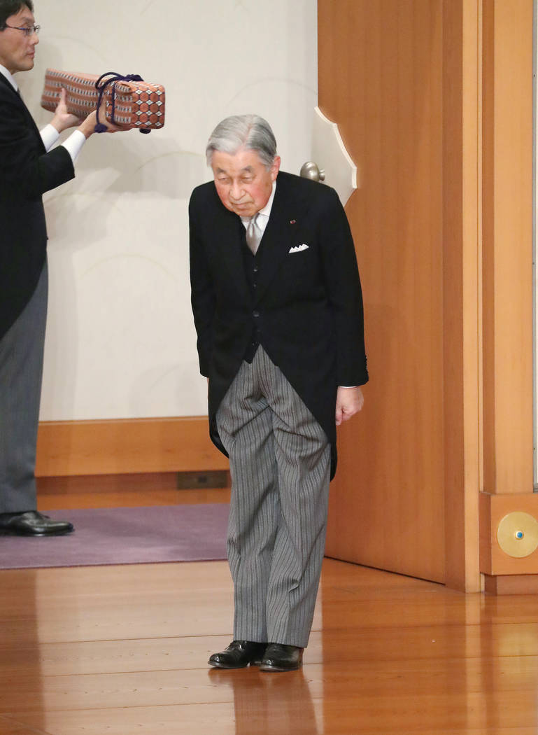 Japan's Emperor Akihito bows before leaving after the ceremony of his abdication in front of ot ...