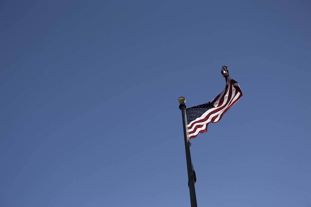 A flag flys in the wind outside the Leatherneck Club in Las Vegas, Thursday, June 14, 2018. Rac ...
