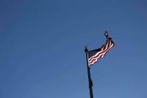 A flag flys in the wind outside the Leatherneck Club in Las Vegas, Thursday, June 14, 2018. Rac ...