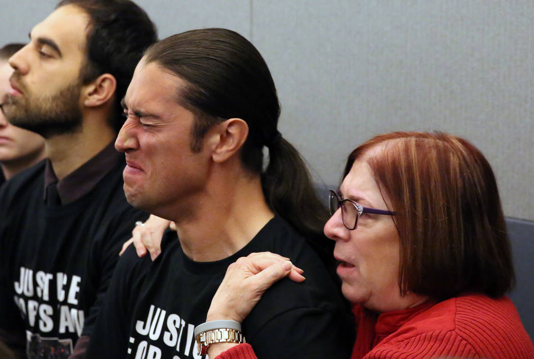 Jennifer Gee Mandarino, right, the mother of murder victim Sean Babbitt, comforts her son Chris ...