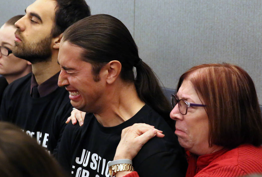 Jennifer Gee Mandarino, right, the mother of murder victim Sean Babbitt, comforts her son Chris ...