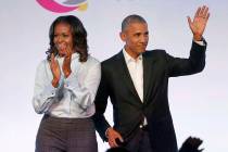 Former President Barack Obama, right, and former first lady Michelle Obama appear Oct. 31, 2017 ...