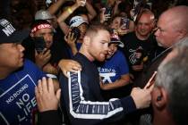 Saul "Canelo" Alvarez takes a photo with a fan during his grand arrival at MGM Grand ...