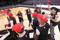 Members of the WNBA Las Vegas Aces Wild Card Crew, celebrate after finding out they made the te ...