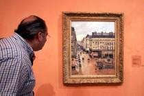 This May 12, 2005 file photo shows an unidentified visitor viewing the Impressionist painting c ...