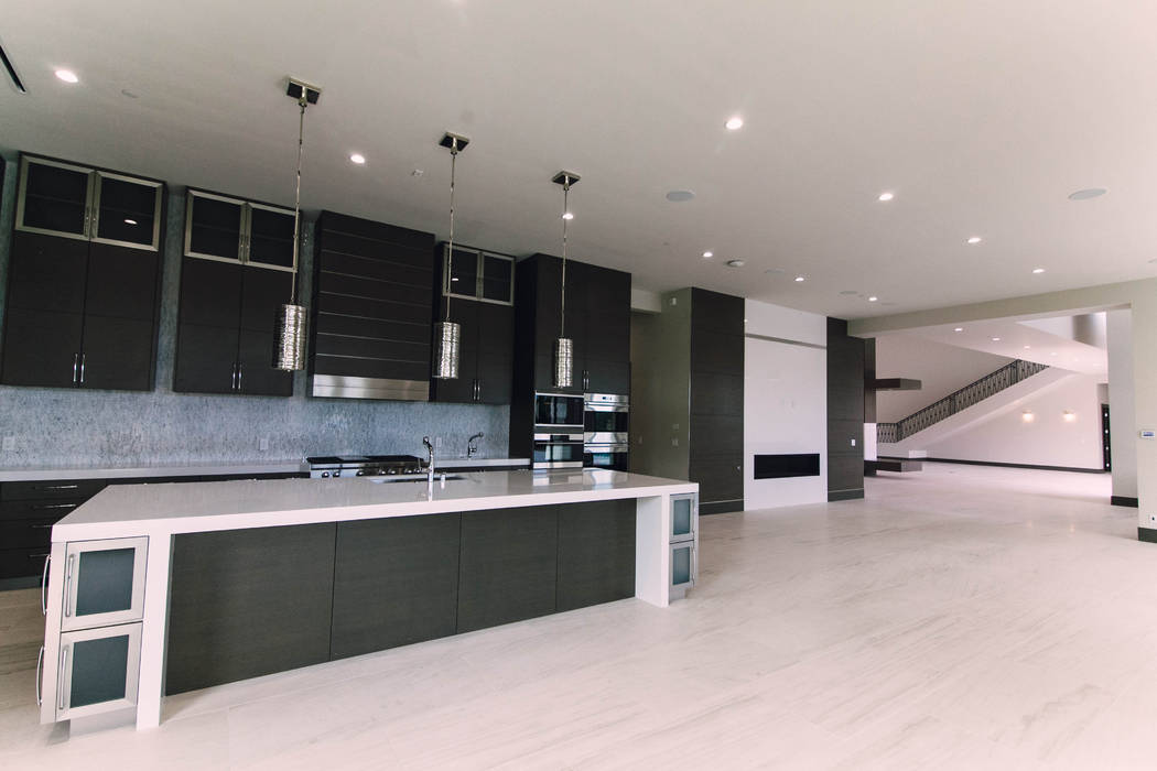 The kitchen has a modern, sleek look. (Growth Luxury Homes)