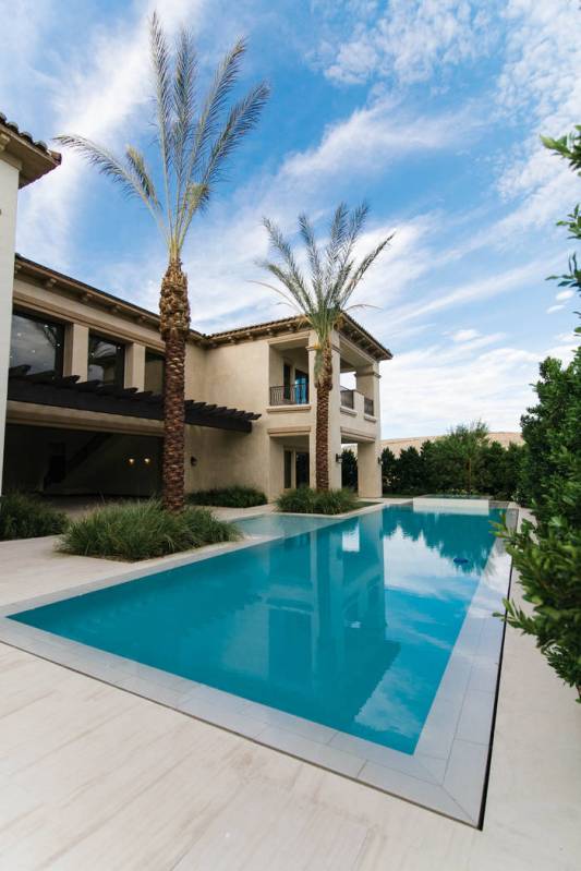 A pool is in the backyard. (Growth Luxury Homes)