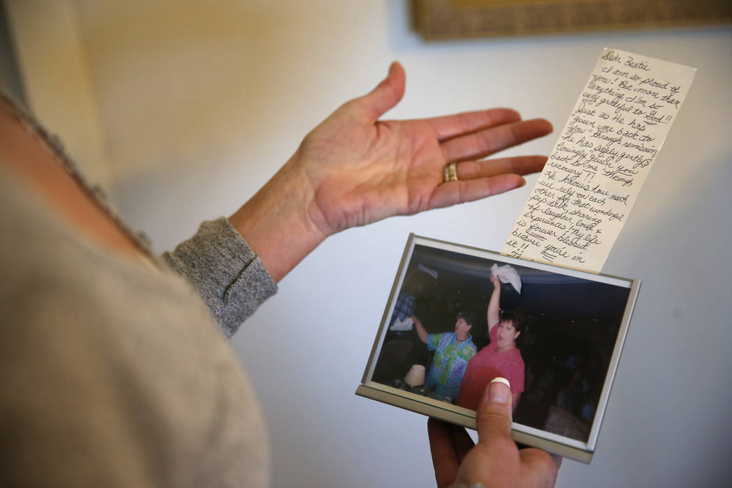 Bea Aikens shows a letter her sister wrote for her with a picture of the two at her Boulder Cit ...