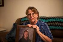 Rhonda Hunnel holds a portrait of her daughter Regina Krieger at her home in Henderson, Wednesd ...