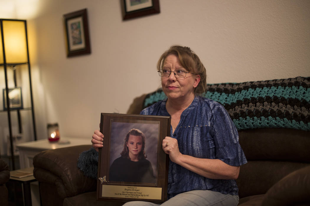 Rhonda Hunnel holds a portrait of her daughter Regina Krieger at her home in Henderson, Wednesd ...