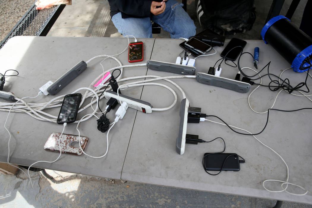 Phones and other devices are charged at the City of Las Vegas Courtyard Homeless Resource Cente ...