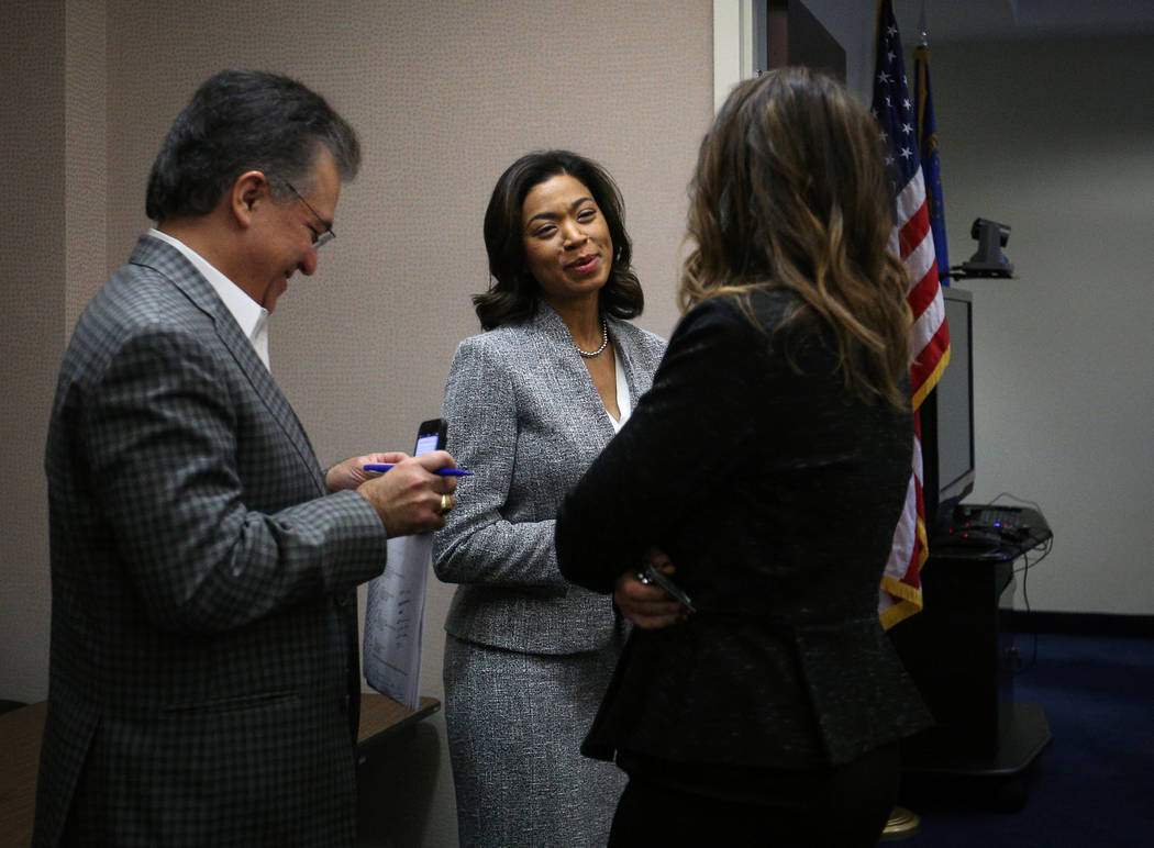 Sandra Morgan, new chairwoman of the state Gaming Control Board, speaks with Tony Alamo, left, ...