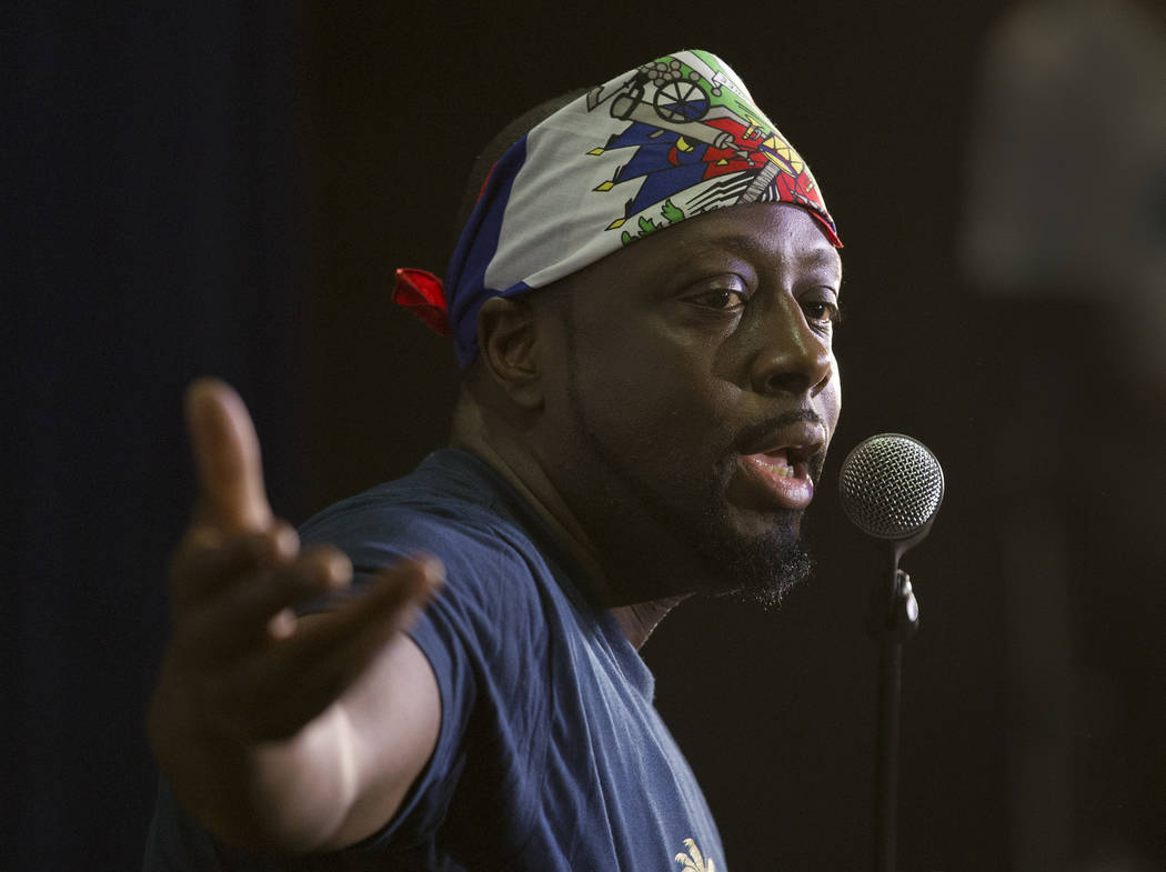 In this, Friday, May 19, 2017 photo, Haitian-American hip-hop star Wyclef Jean gestures as he s ...