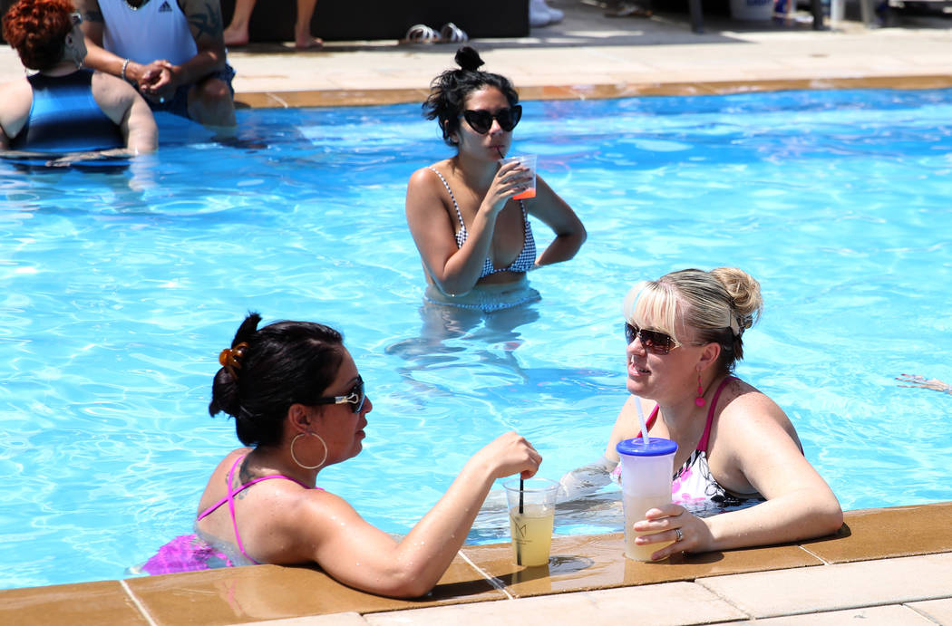Gwen Hensley, left, of Salt Lake, Utah, and her friend Michelle Roberts of Las Vegas relax at M ...
