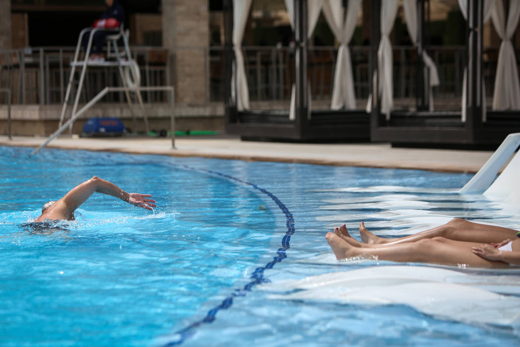 People relax out at the pool at the M Resort in Henderson, Thursday, April 4, 2019. (Caroline B ...