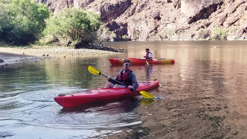 Ryan Burt (closer), 15, and Will West, 15, take a break along an Arizona beach along Black Cany ...