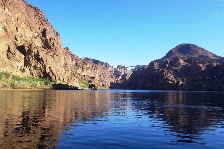 Kayakers enjoying the calm waters in the shadows of early morning. (Natalie Burt)