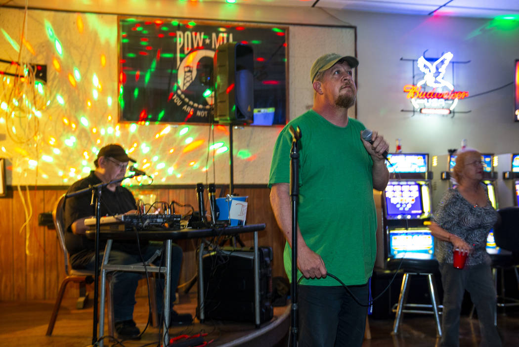 Ron Cochran sings some country music while joining a group of friends during their weekly karao ...