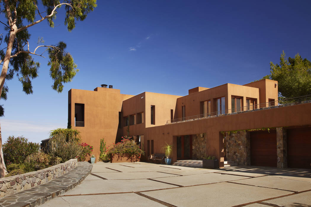 Bold and intense color choices can really enhance the drama and visual of a desert modern home. ...