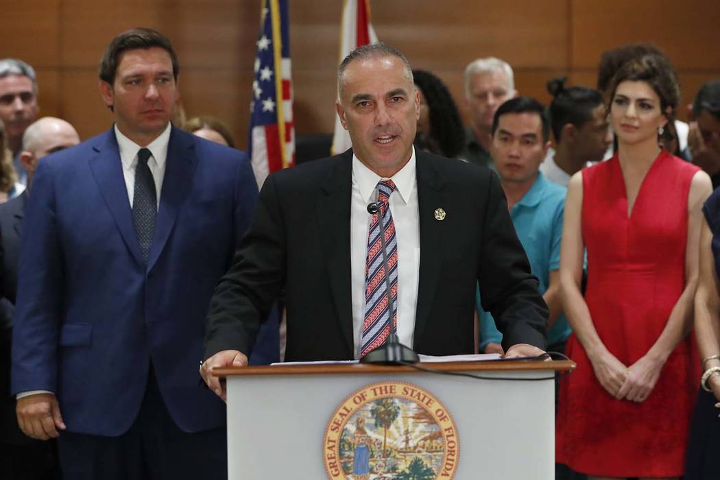 Andrew Pollack, center, father of Meadow Pollack, who was killed in the Parkland, Fla., school ...