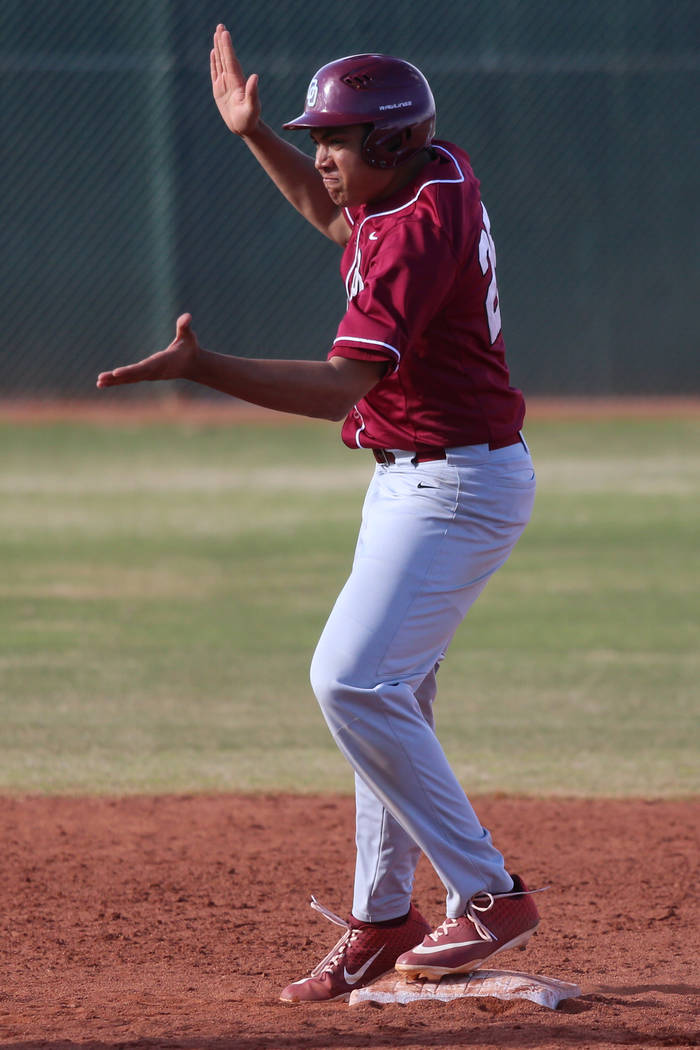 Desert Oasis' Aaron Roberts (25) reacts after a two run hit against Bishop Gorman in the baseba ...
